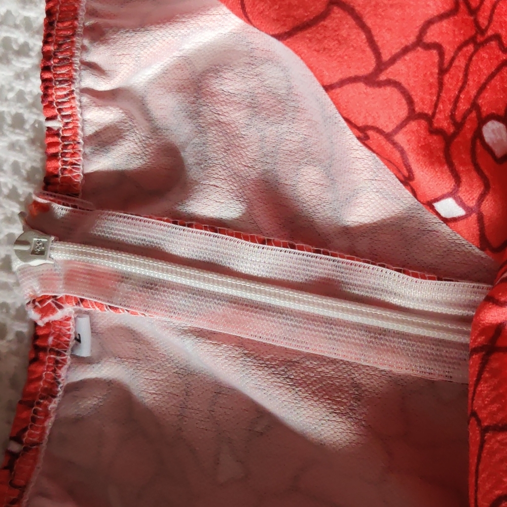 Off the shoulder with attached short sleeves. - Picture 6 of 9